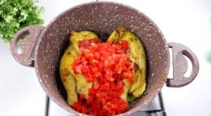 Add two tablespoons of tomato paste with the peeled tomatoes