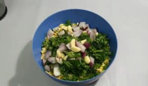 In a large bowl, put the beans, coriander, dill, Leeks, garlic, and onion (chop the onions).