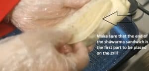 Make sure that the end of the shawarma sandwich is the first part to be placed on the grill