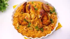 Put the chicken on the rice, then decorate the dish with nuts and a little parsley or coriander to give an interesting color (the nuts can be fried in a little oil for 2 minutes before using them to get a wonderful taste)