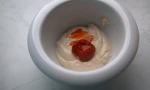 Put the chili paste and a little chili sauce on the tahini and stir well