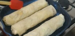 Put the shawarma wrap in the grill