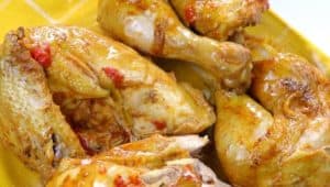 While the rice is cooking, brush the chicken with butter and then place it in the oven on the grill for 10 minutes.