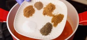 Add half the amount of spices (salt - cumin - seven spices - dry mint - dry coriander - black pepper)