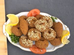 Remove the Arabic falafel from the pan when it takes on a dark copper color, then put it in a strainer, and then put it on a serving plate.