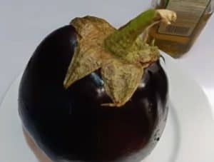 Wash the eggplant well and make some holes in it